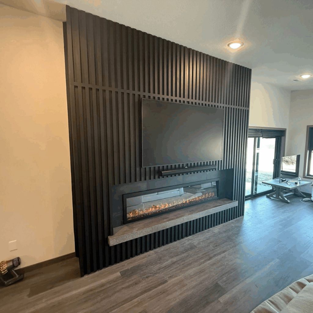 Custom feature wall with modern fireplace installation in Spirit Lake Iowa
